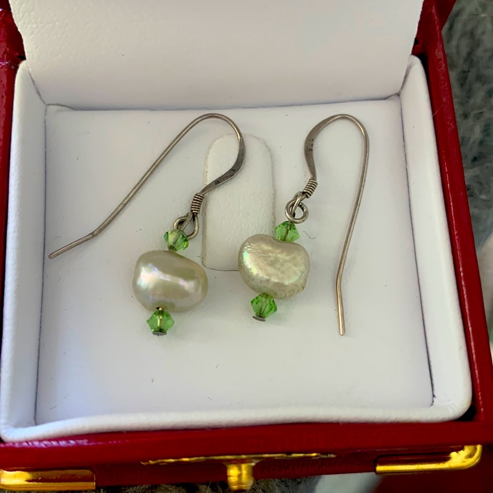Pretty green pearl earrings.